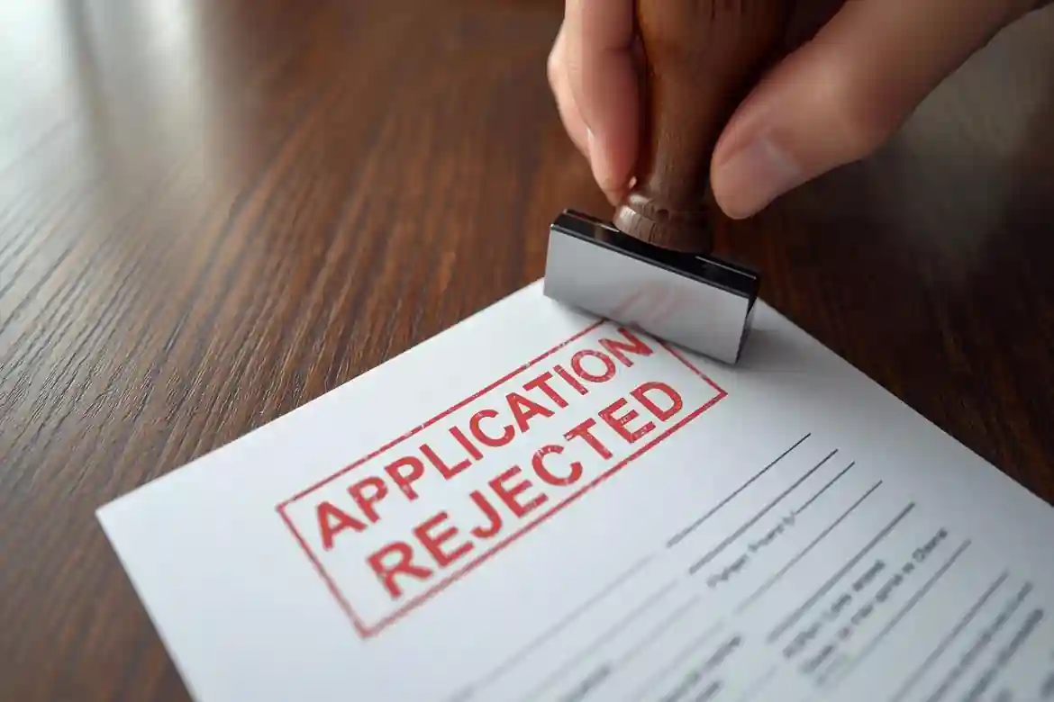 Job application stamped rejected, showing common IT job rejection reasons